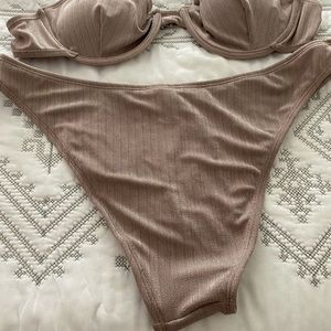 Bikini in tan high on the hip. Runs true to size.